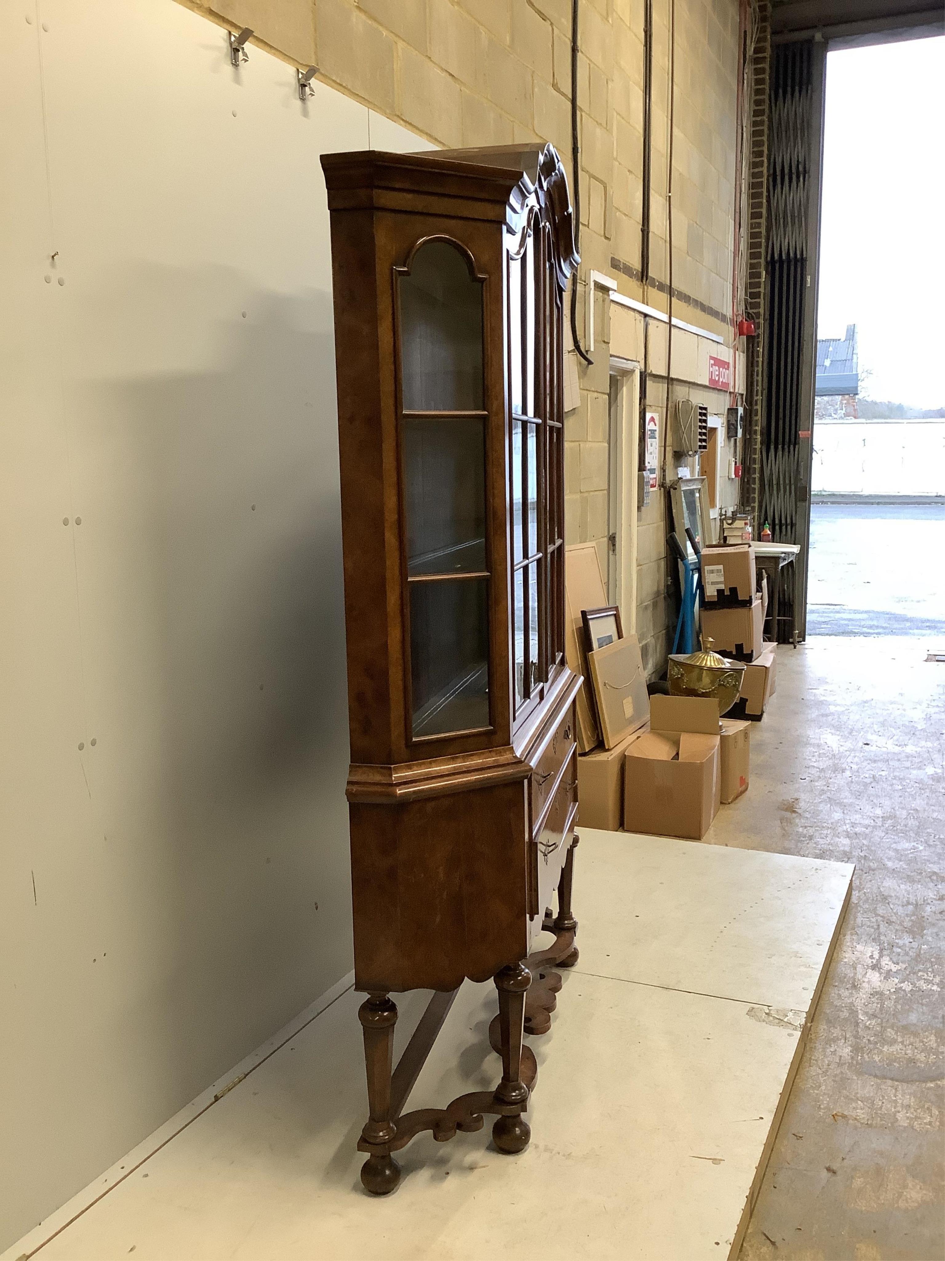 An 18th century style Dutch walnut display cabinet, width 136cm, depth 33cm, height 208cm. Condition - fair to good